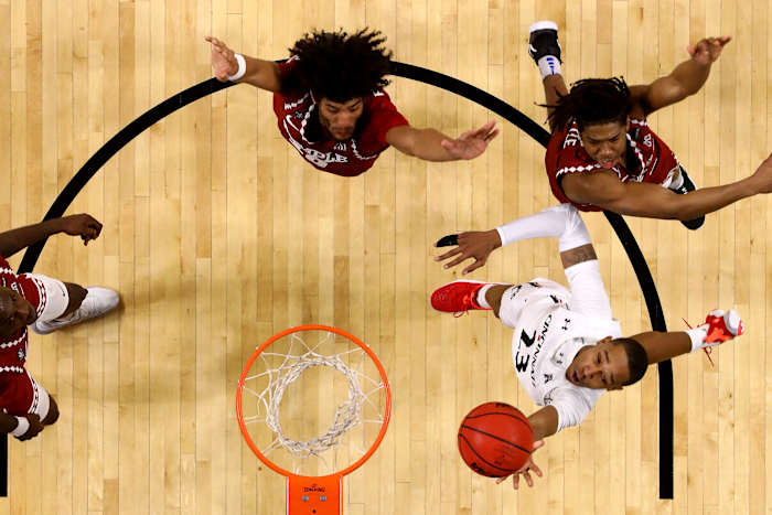 Cincinnati Bearcats guard Mika Adams-Woods (23) scores at the basket in the second half of an NCAA men's college basketball game against the Temple Owls, Friday, Feb. 12, 2021, at Fifth Third Arena in Cincinnati. The Cincinnati Bearcats won, 71-69. Temple Owls At Cincinnati Bearcats Feb 12